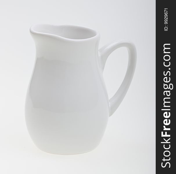 Close-up white jug to background