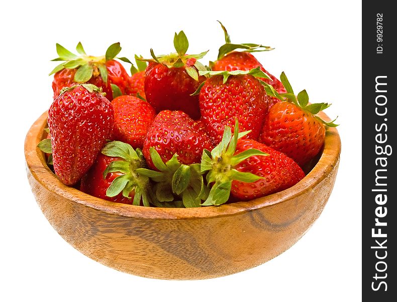 Fresh strawberries on a wooden platter isolated on white background