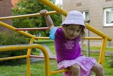 Little Girl On The Playground Stock Photos