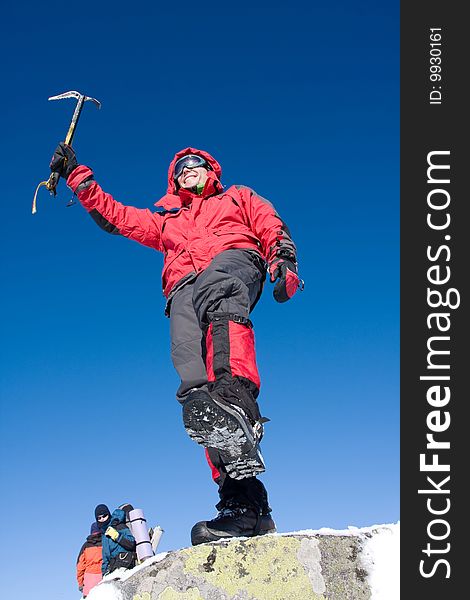 Hiker in winter in mountains