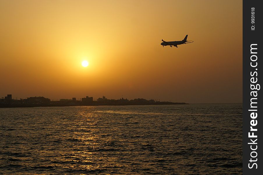 An airplane is going to a sunset. An airplane is going to a sunset