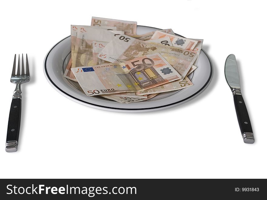 Fifty Euro Banknotes on a plate with fork and knife isolated over white background