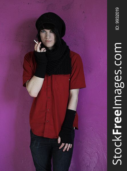Portrait of young man in red shirt and black scarf. Portrait of young man in red shirt and black scarf
