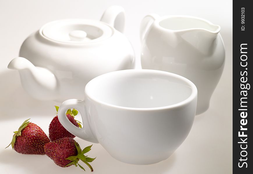 Prepared for tea drink. Dishware still-life with strawberry