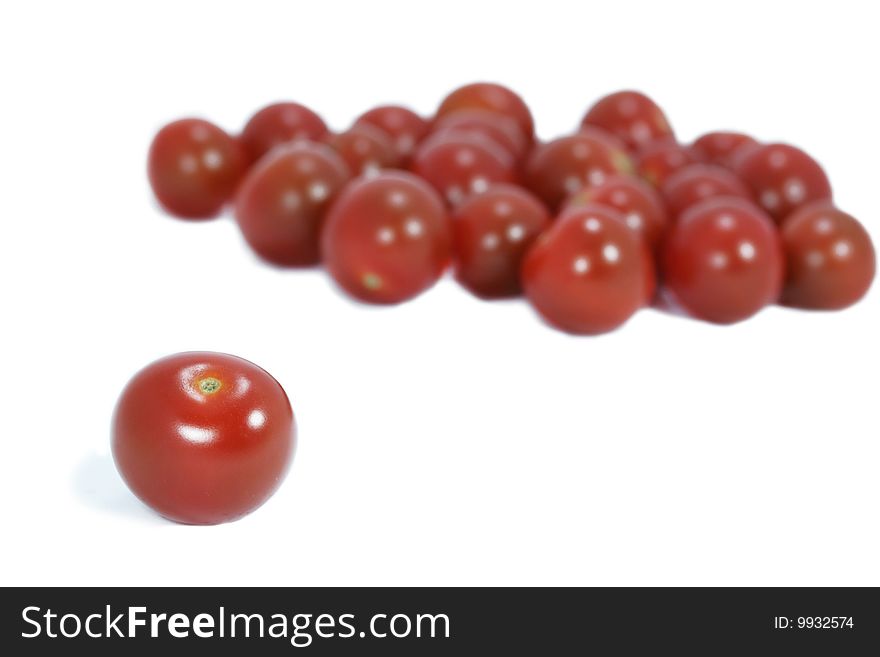 One and group of cherries on white