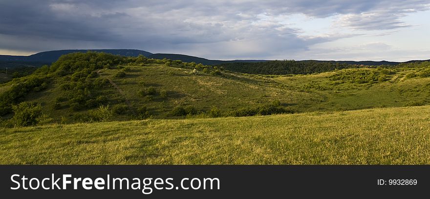 Friendly landscape with a road on the hills. Friendly landscape with a road on the hills