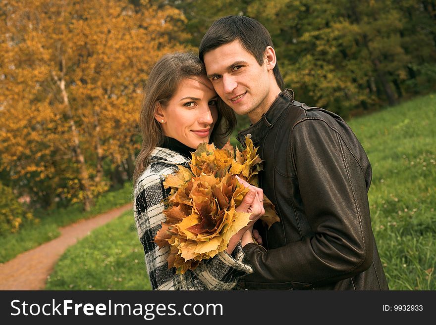 Young  Couple In Autumn Park