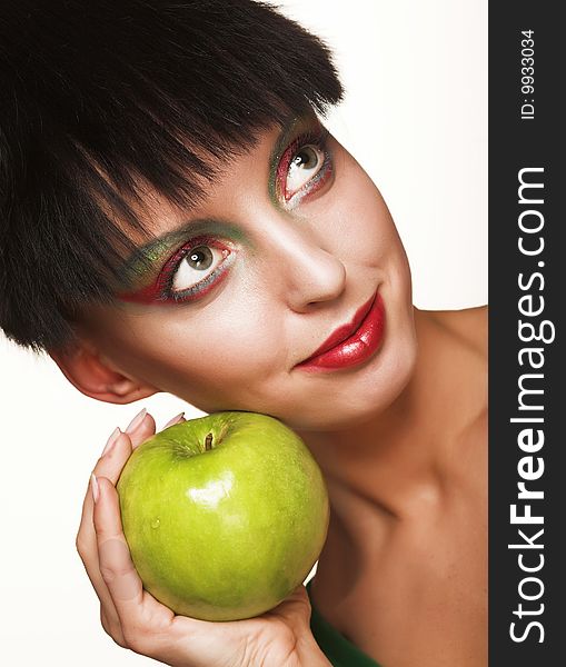 Beautiful woman with apple isolated on white