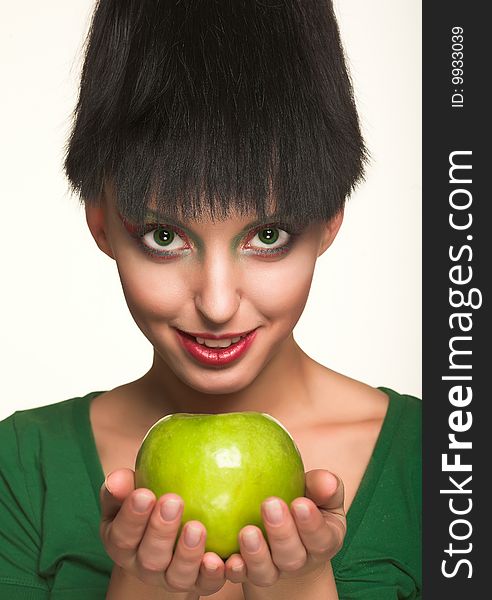 Beautiful woman with apple isolated on white