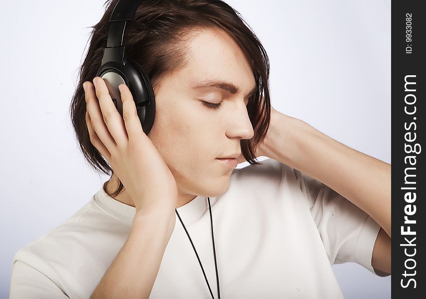 Casual man listening to music