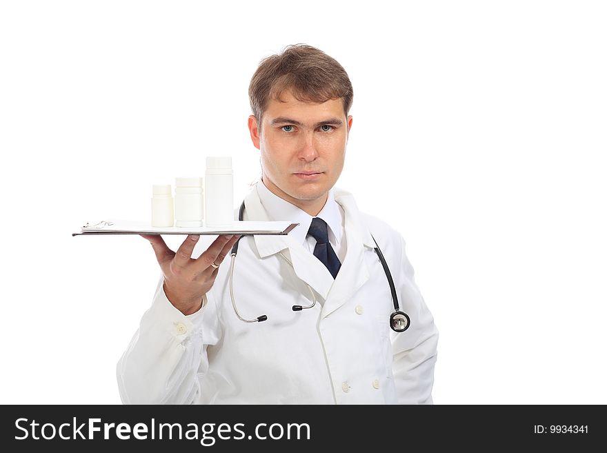 Medical theme: serious doctor holding pills.