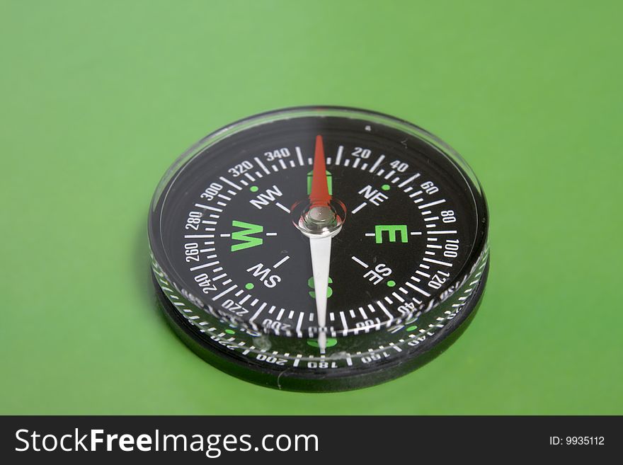 The Green background and traditional black compass. The Green background and traditional black compass
