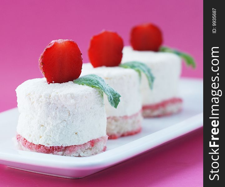 Curd Tenderness On Air Biscuits With A Strawberry