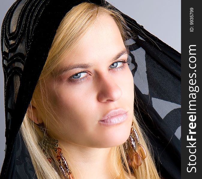 Beautiful blondy with black scarf posing, studio shot
