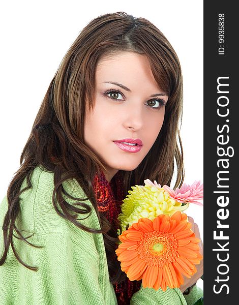 Close-up of beautiful woman with flower, studio shot