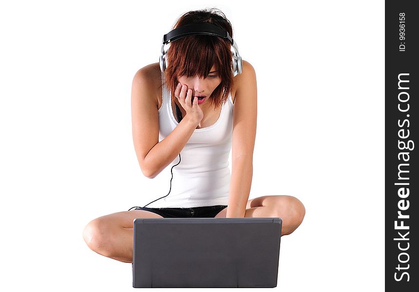 Very seductive young asian woman listening music from the computer