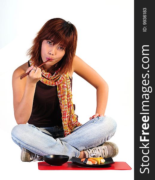 Young Asian Woman Eating Sushi