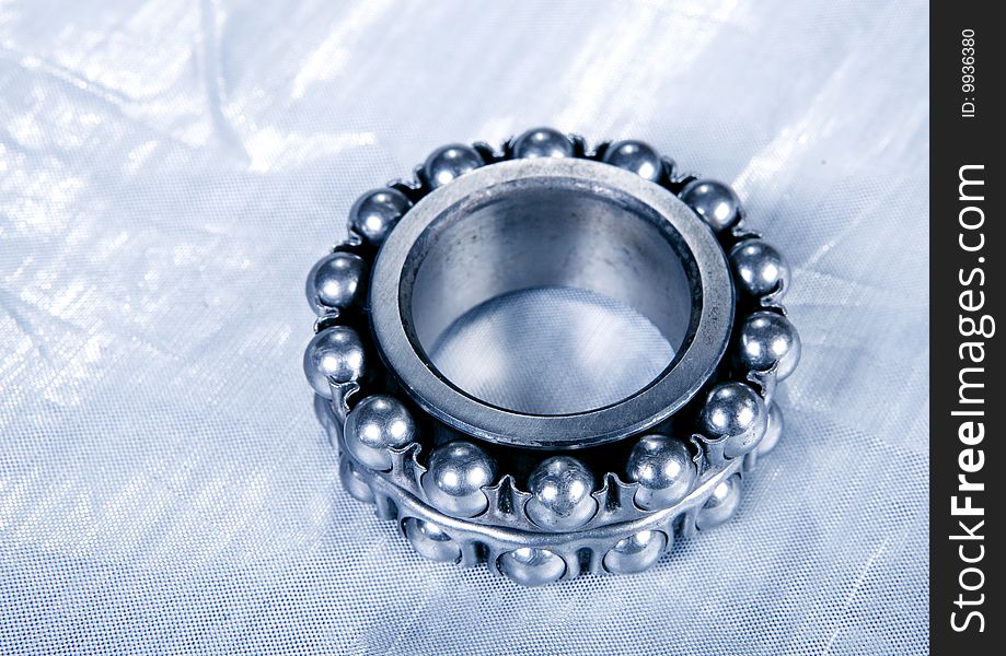 Ball bearing on silver background. Ball bearing on silver background