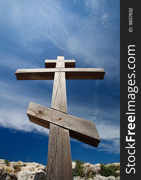 Wooden cross against blue sky