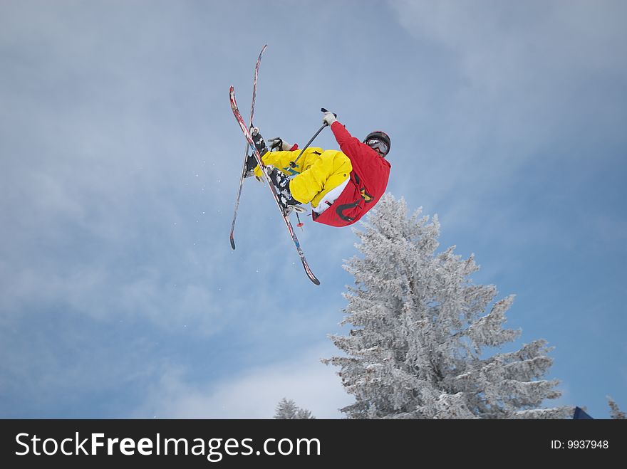 Skier is doing a super hard trick. Skier is doing a super hard trick