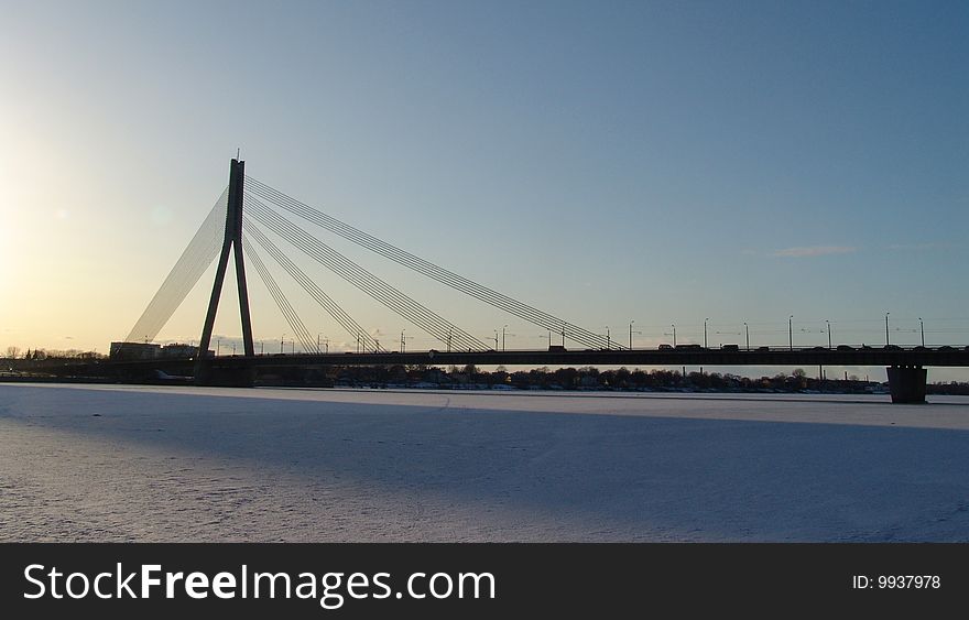 Modern big concrete bridge over Daugava River in Riga, Latvia.