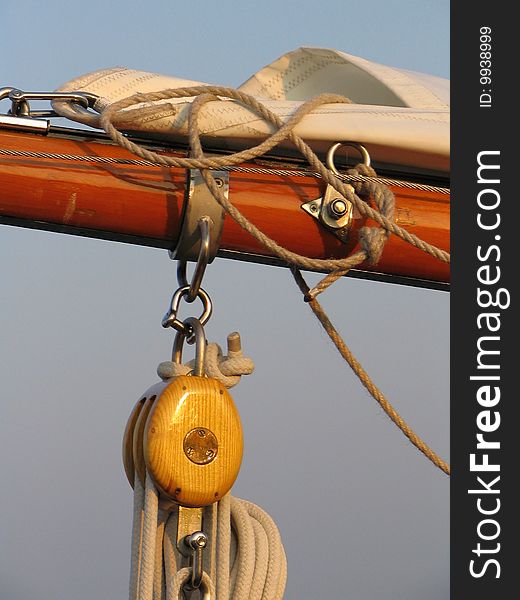 Detail sailing boat in warm light by upcoming sun. Detail sailing boat in warm light by upcoming sun