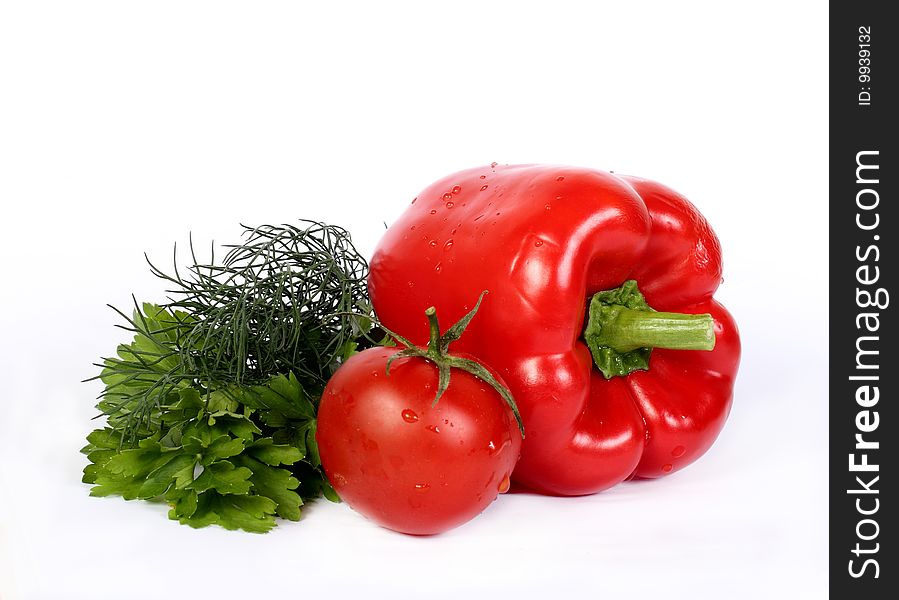 Tomato, sweet pepper and greens bunch on a white background. Tomato, sweet pepper and greens bunch on a white background