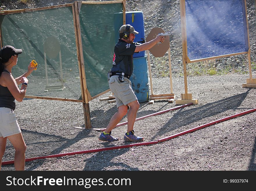 A person practices at a shooting range.