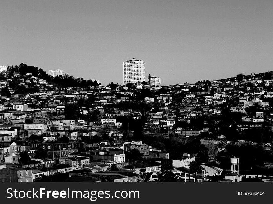 Aerial view of roof tops in hillside town in black and white. Aerial view of roof tops in hillside town in black and white.