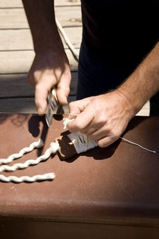 Sailor Cutting Cables In A Ship S Deck Royalty Free Stock Images