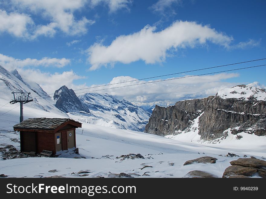 Small ski chalet in winter in a snowy mountain