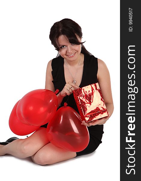 The girl with red balloons and gift. The girl with red balloons and gift