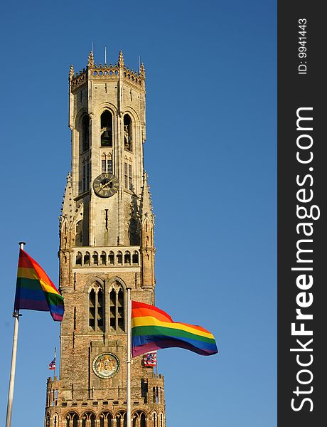 Rainbow flags on the Belfry in Bruges Belgium during the Gay parade. Rainbow flags on the Belfry in Bruges Belgium during the Gay parade