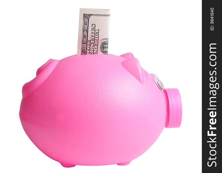 A piggy bank with a hundred dollar stuck into it.