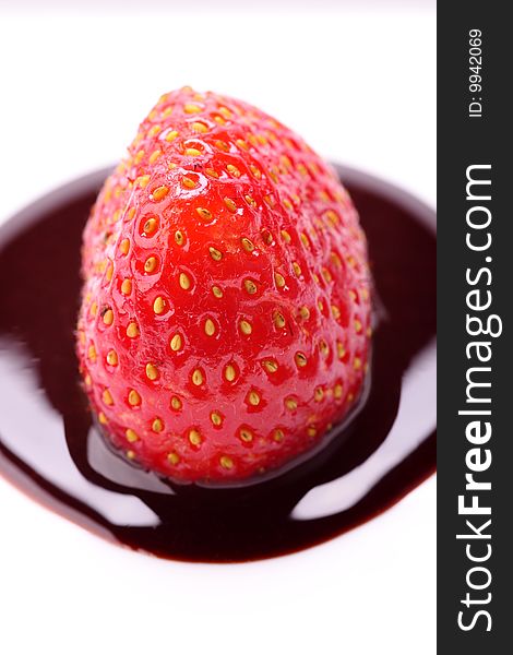 Strawberry in chocolate on white background