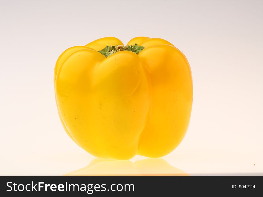 Close-up of fresh yellow pepper on white background