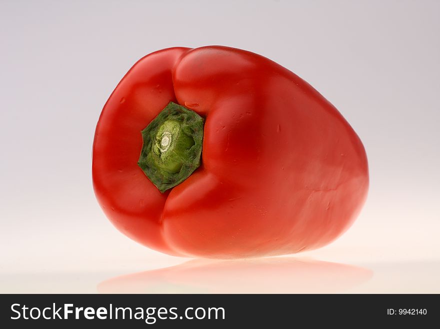 Close-up of fresh red pepper on white background. Close-up of fresh red pepper on white background