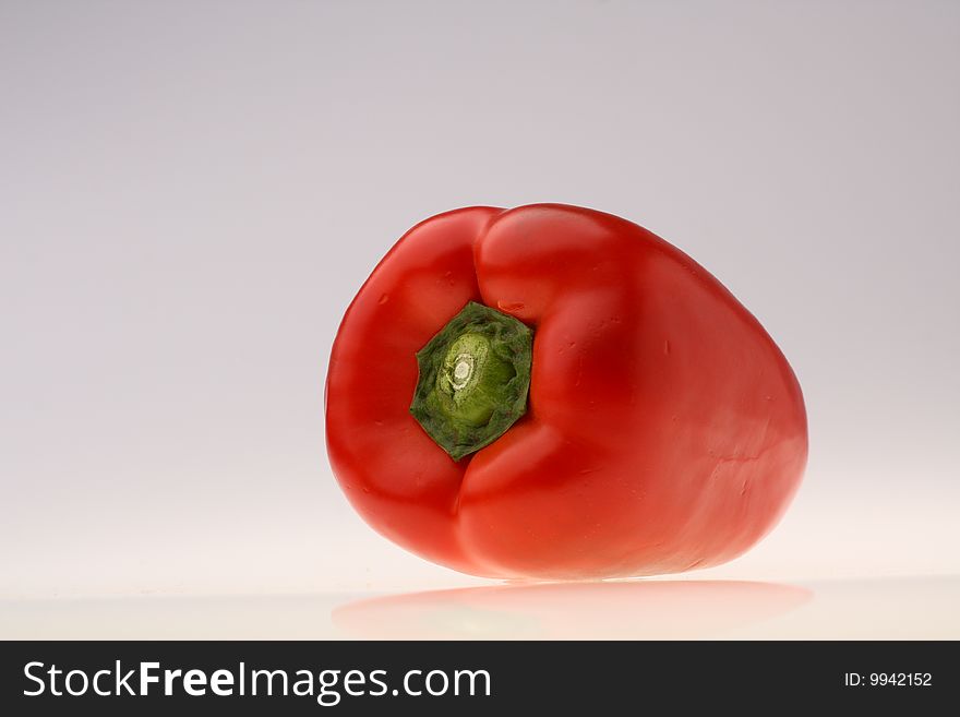 Close-up of fresh red pepper on white background. Close-up of fresh red pepper on white background