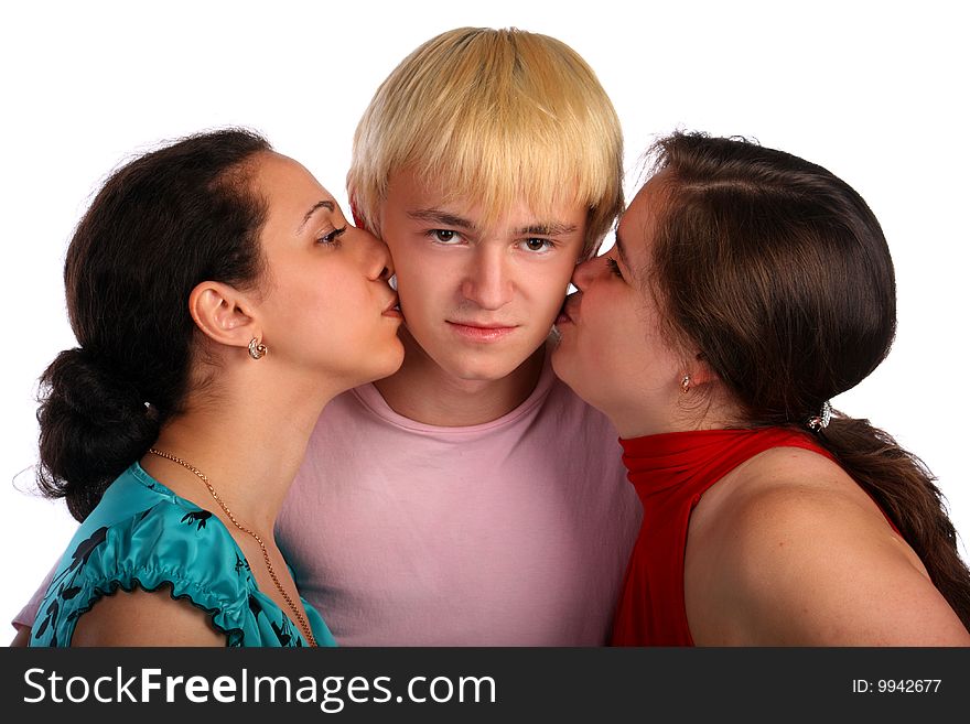 Two girls and young man kisses. Isolated.