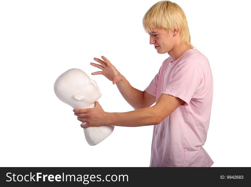 Young man in pink shirt holds gypsum head