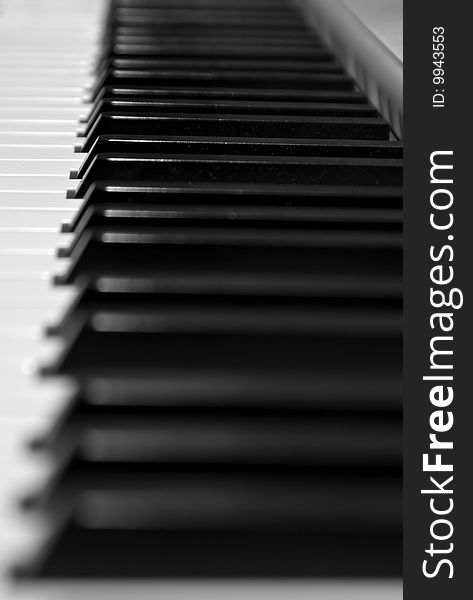 Keyboard of a grand piano: focus on a keys on the center