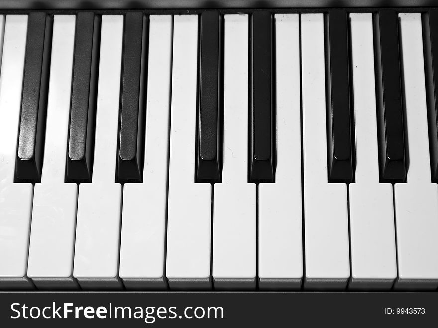 Keyboard of a grand piano. Gratscale image.