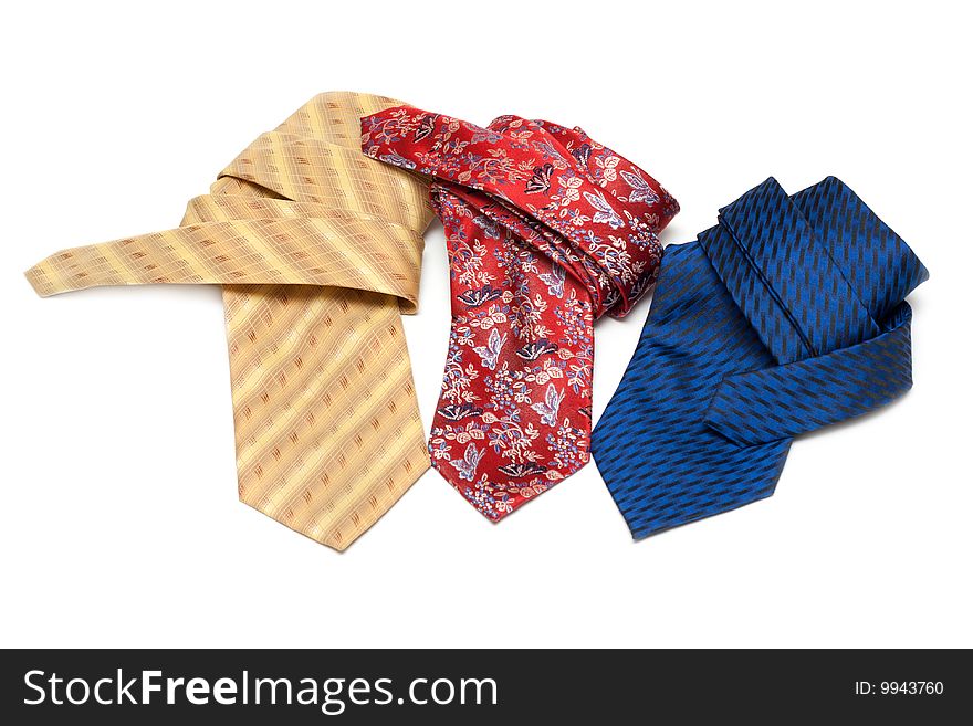 Three ties convolute and rest upon white background