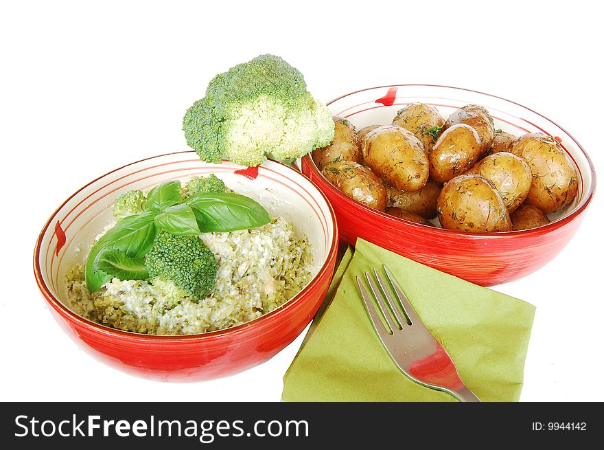 Vegetables for lunch in two red bowls