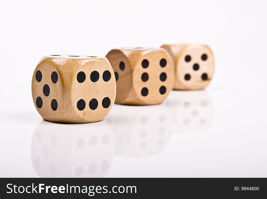Wood dice on white background.