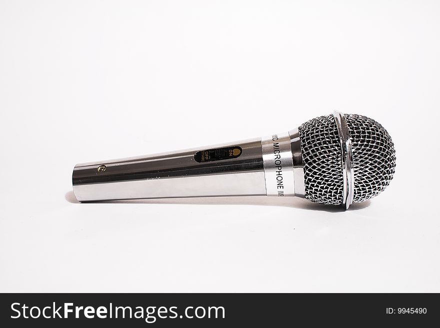 Microphone close-up. Isolated on a white background. Microphone close-up. Isolated on a white background.