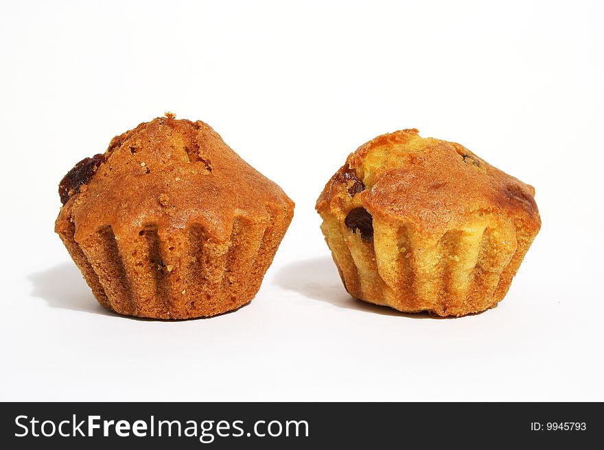 Muffins, pastries, close-up isolated on a white background. Muffins, pastries, close-up isolated on a white background.