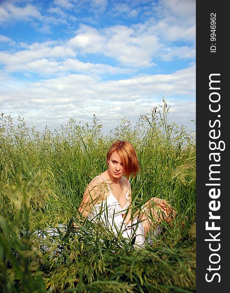 Relaxing girl in the grass