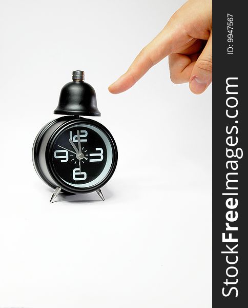 Hand With Black Alarm Clock