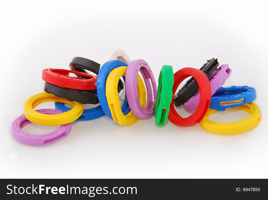 Key protectors of rubber in different colors on a white background. Key protectors of rubber in different colors on a white background